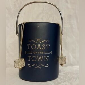 Kate Spade “Toast of the Town” champagne bucket handbag lwith drawstring closure